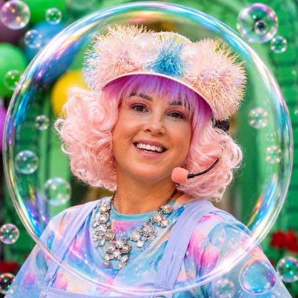 Miss Molly smiling inside a giant bubble