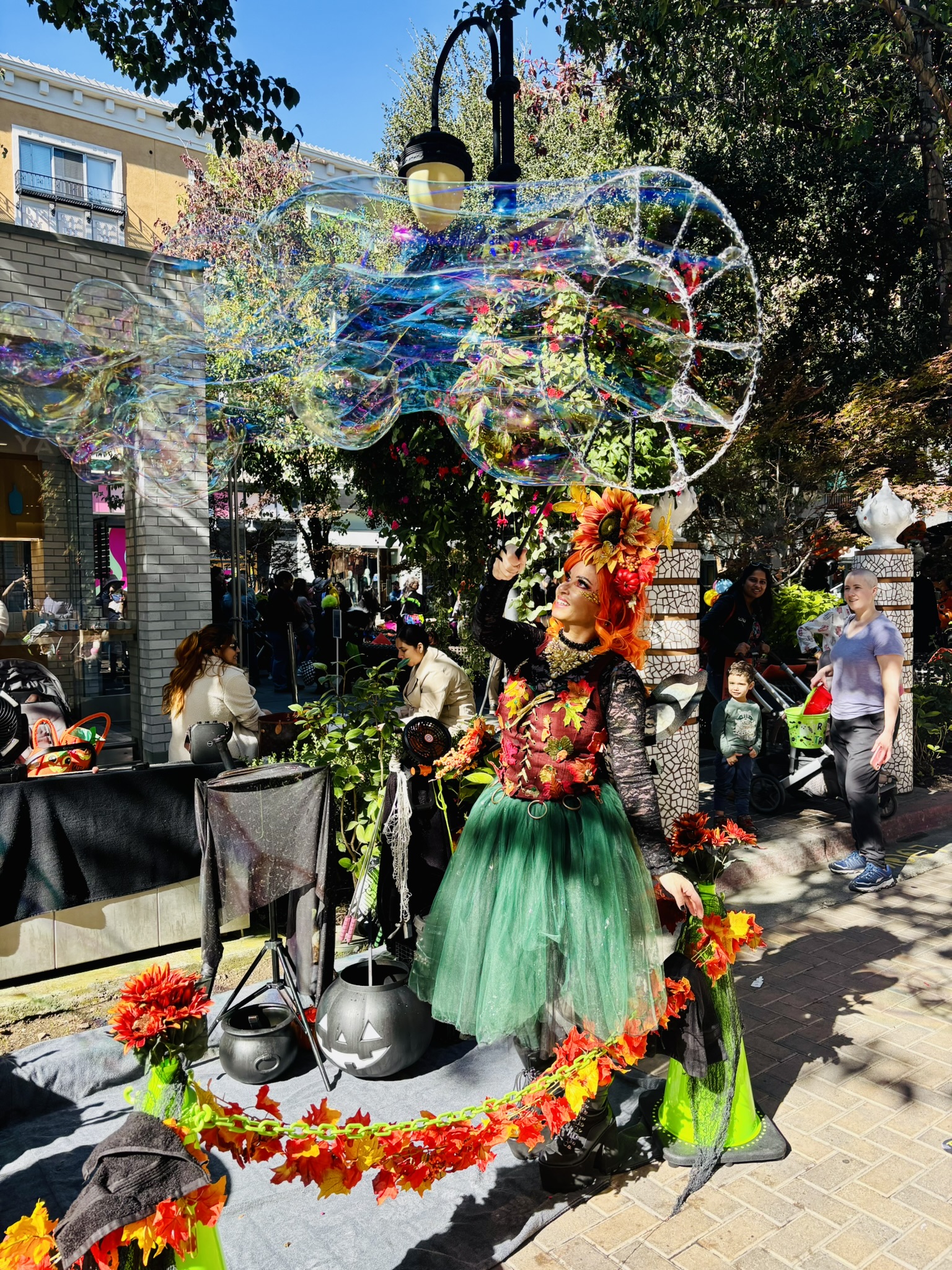 Miss Molly making bubbles in her fairy costume at Santana Row